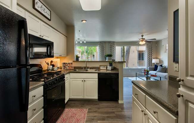 Kitchen with modern appliances and open concept floor plan in mesa az at Vista Grove Apartments, Mesa
