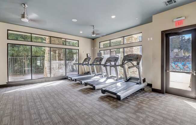 the preserve at ballantyne commons fitness room with cardio machines and windows