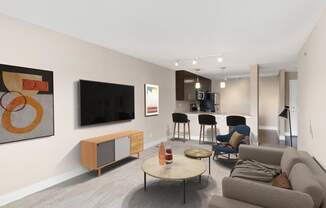 a living room filled with furniture and a flat screen tv