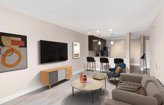 a living room filled with furniture and a flat screen tv