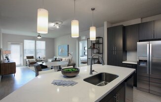 Quartz countertops and islands with overhead lighting