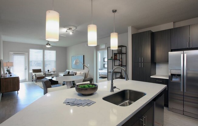 Quartz countertops and islands with overhead lighting