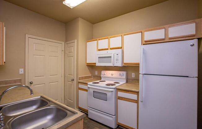 a kitchen with a stove top oven sitting inside of a refrigerator