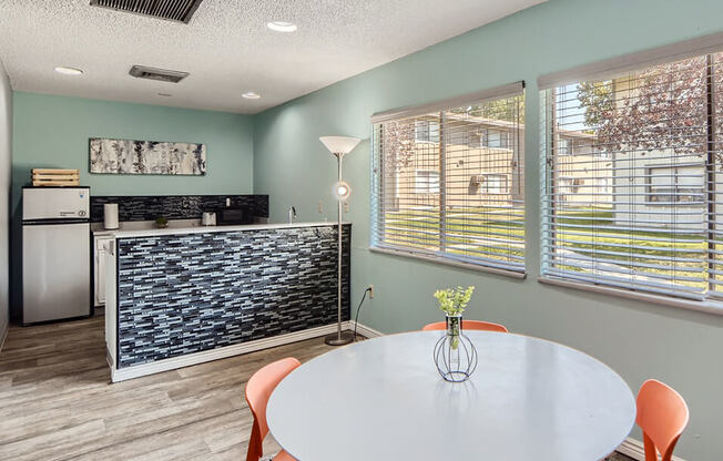 Clubhouse with table and kitchen area