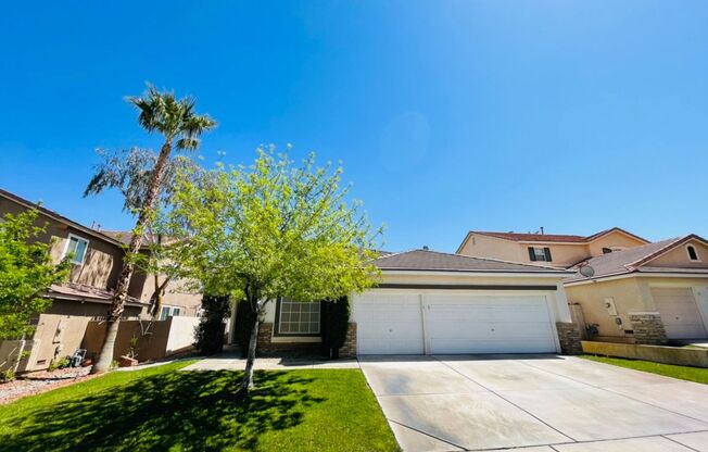 Single-story 4 Bed nestled in the desirable Green Valley Ranch!  3 Car Garage!