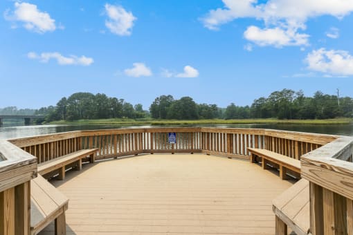 a circular deck with benches overlooking a lake at Linkhorn Bay Apartments, Virginia Beach, Virginia
