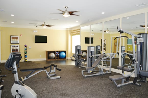 24-Hour Fitness Center with Cardio Machines and Yoga Area
