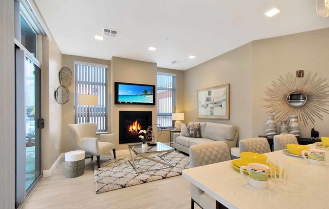 a living room with a fireplace and a table