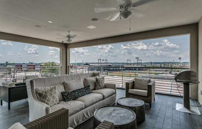 Rooftop entertainment area with electric grills at Flats on 4th Apartments in Birmingham, AL