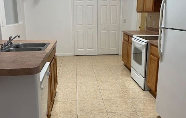 Beautiful 3/2/2 house with laminate floors, tiles, screen porch, luscious lawn, sprinkler system and much more.