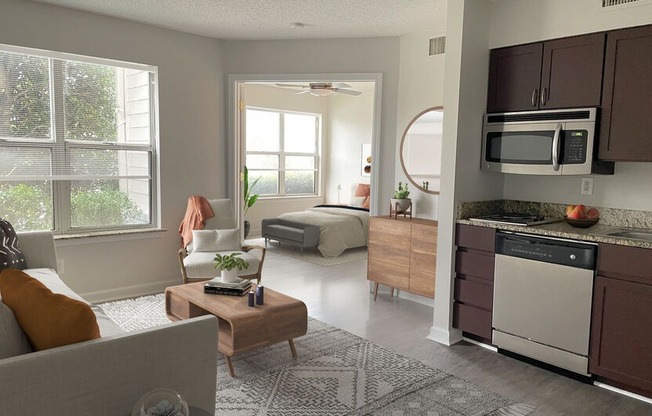 furnished kitchen and living room overlooking bedroom