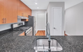 a kitchen with granite counter tops and a sink