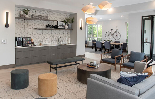 a living room with couches and chairs