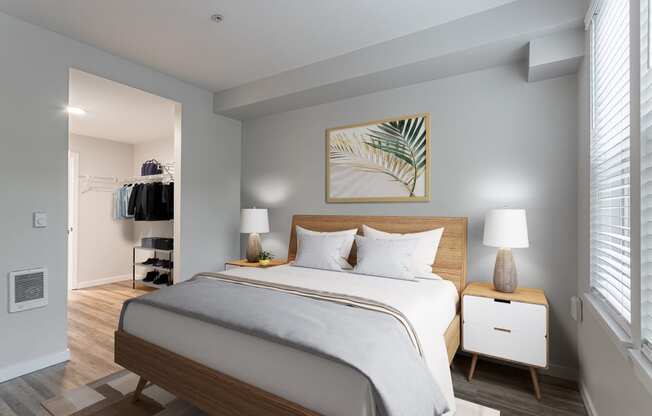 a bedroom with a large bed and a closet in a 555 waverly unit