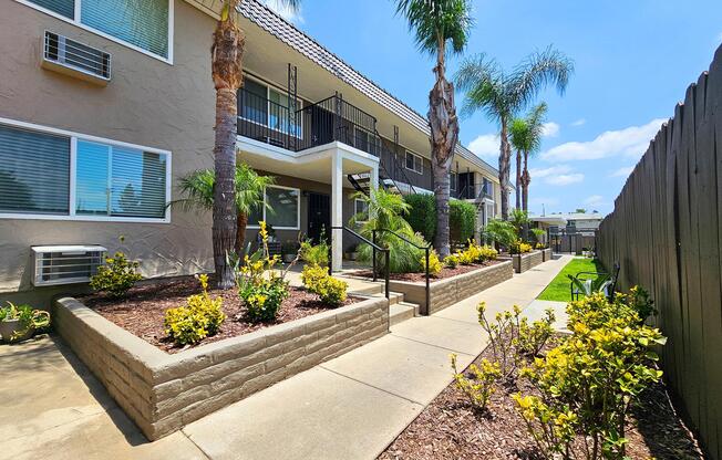 a house with bushes in front of a building