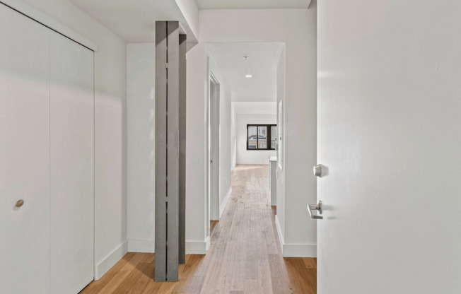 Step into this stylish hallway, where contemporary design meets warm, inviting aesthetics.