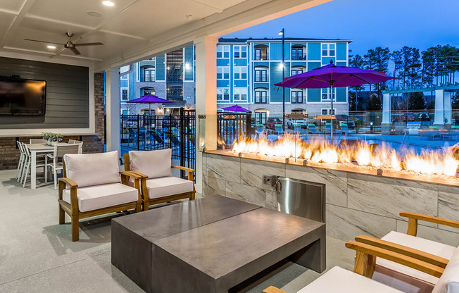 the residence club living room with fireplace and bar