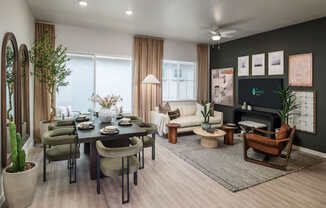 A modern living room with a dining table set for six.