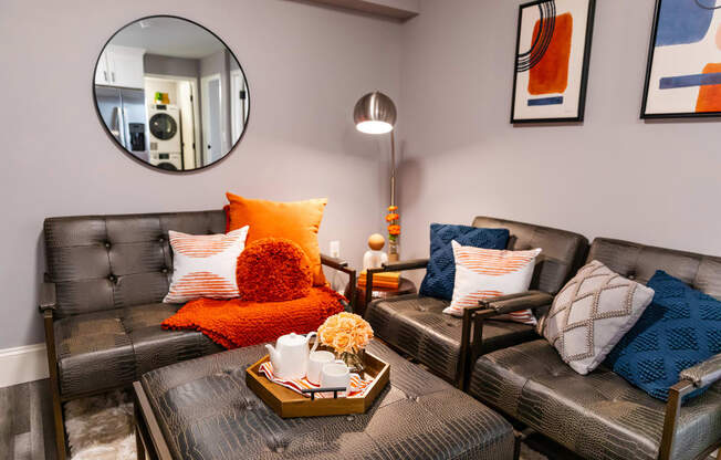 living room with couches and a coffee table and a mirror