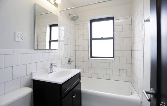 The Edison apartments bathroom with tile backsplash