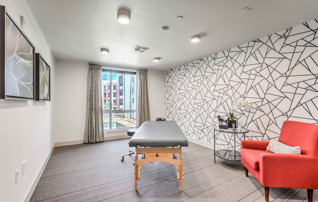 room with massage table at arte apartments