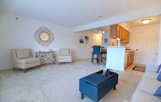 a living room with a couch a chair and a table