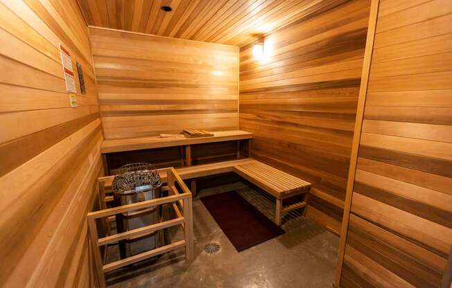 a small sauna with two benches and a table