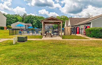 the yard and gazebo at the reserve at walnut creek apartments