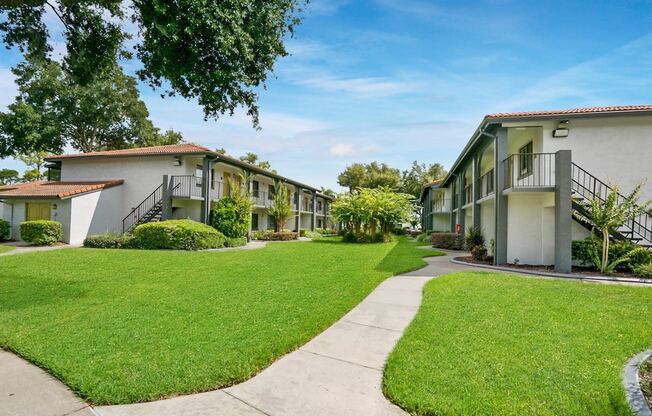 Lush Green Outdoors at The Oasis Apartments, Daytona Beach, FL