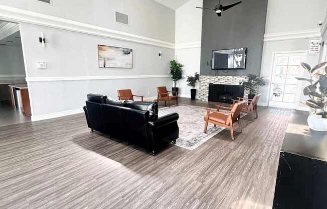 Campbell Plaza Apartments
710 Nido Drive, Campbell, CA 95008. A living room with a black couch and a fireplace.