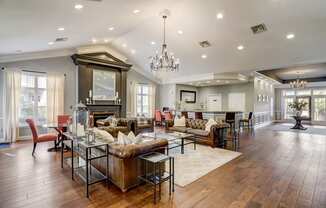 a large living room with couches and a table with chairs