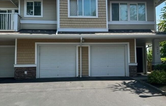 Charming corner 2 bedroom 2 bath with attached Garage!