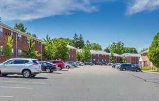 a parking lot in front of a brick building at Nottingham Manor Apartments, New Jersey, 07645