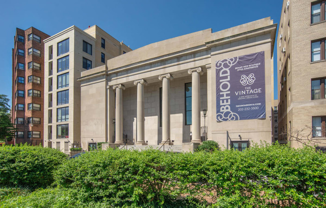 the front of a building with a banner on it