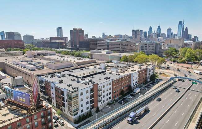 A cityscape with a highway and buildings.