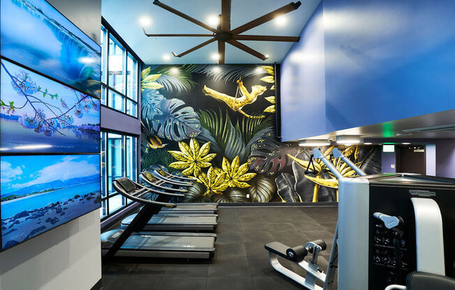 Stunning art mural with HIIT fitness center featuring treadmills and weight stations