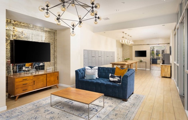 a living room filled with furniture and a large chandelier