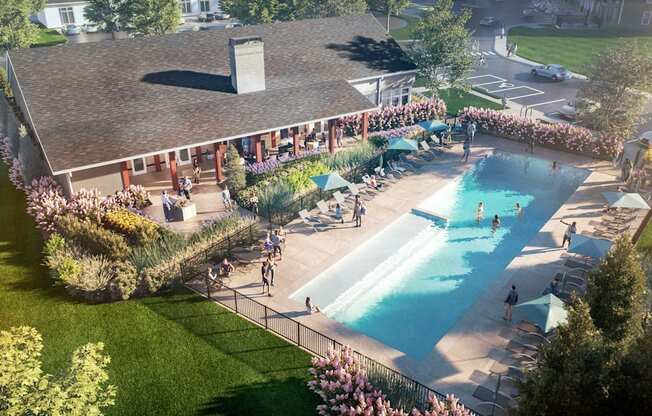 an aerial view of a pool and a building with people in it