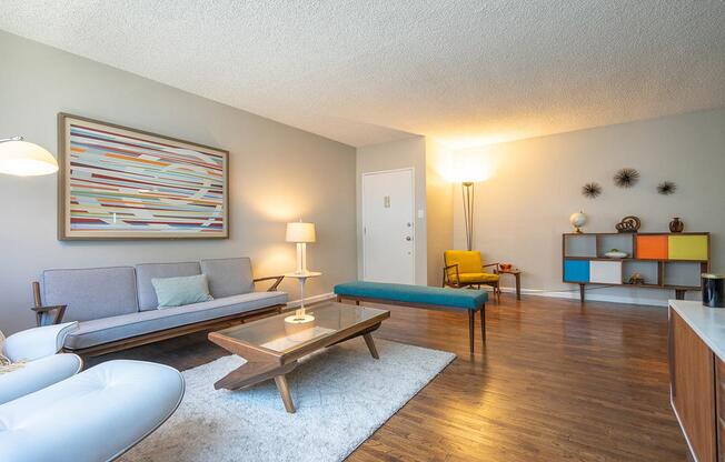 a living room filled with furniture and a flat screen tv