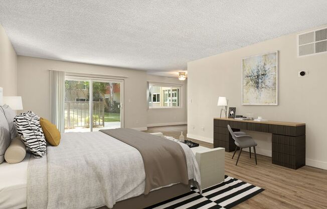 a bedroom with a bed and a desk