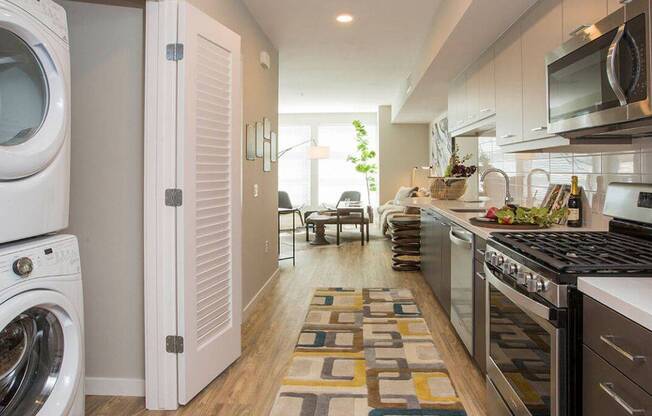 Model Kitchen to Living Room at AV8 Apartments in San Diego, CA