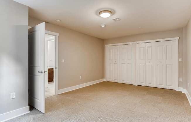 A room with a desk and a window