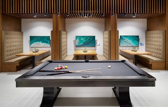 a billiards table in a living room with other furniture
