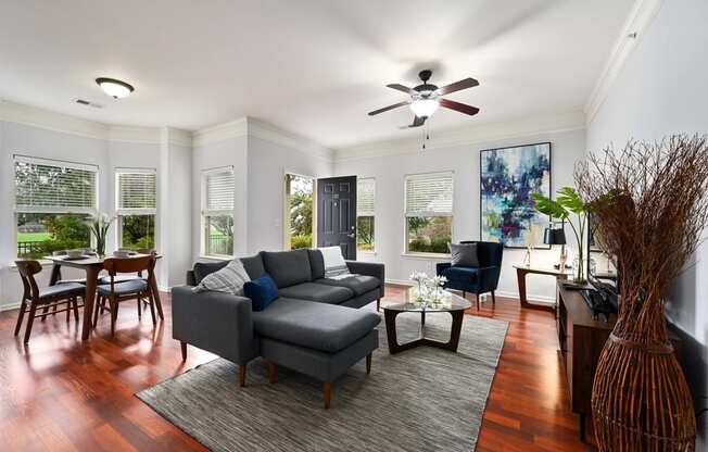 a living room with a couch and a ceiling fan at Sovereign at Overland Park, Kansas, 66213