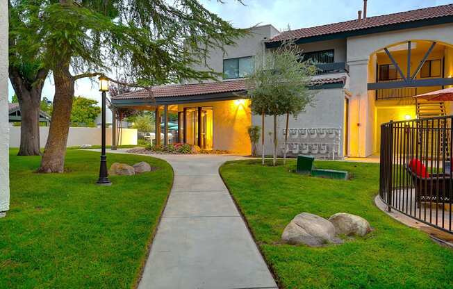 A house with a tree in front of it.