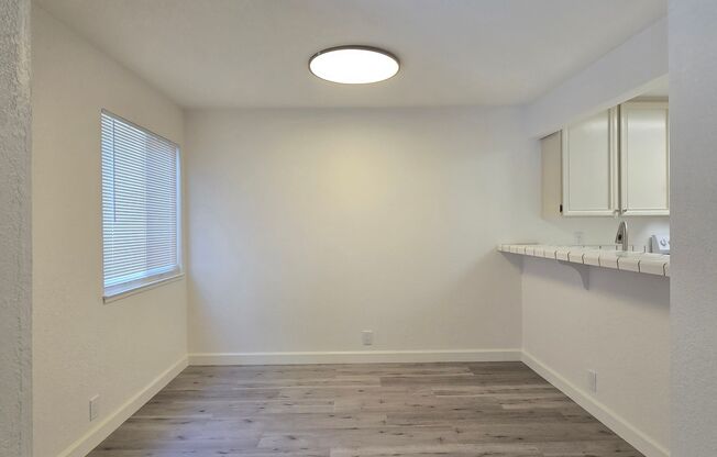 Large Downstairs Condo in Nice Community, New Wood Flooring, Fresh Paint, Garage, Great Location!