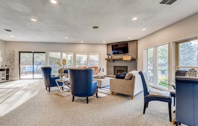 a living room filled with furniture and a large window