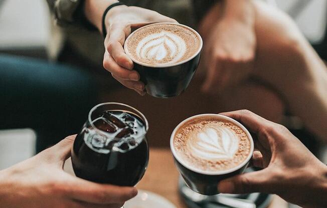 a group of people holding cups of coffee at Monroe Avenue Apartments, Salem, Oregon