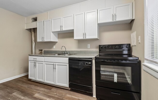 Step into a sleek kitchen at The Preserve On Conley Apartments, featuring modern appliances and ample cabinetry. This stylish space is perfect for culinary enthusiasts and hosts alike. Schedule your tour today to envision your new home!