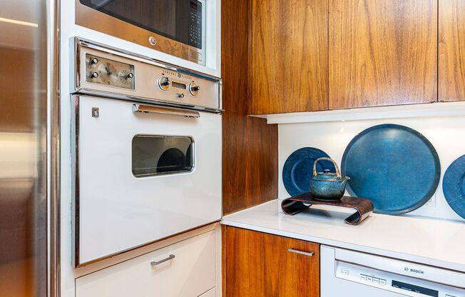 Meticulously maintained 1br + office apartment featuring original 1961 design elements, 24-hour doorman, covered garage parking w/ EV charger and storage.